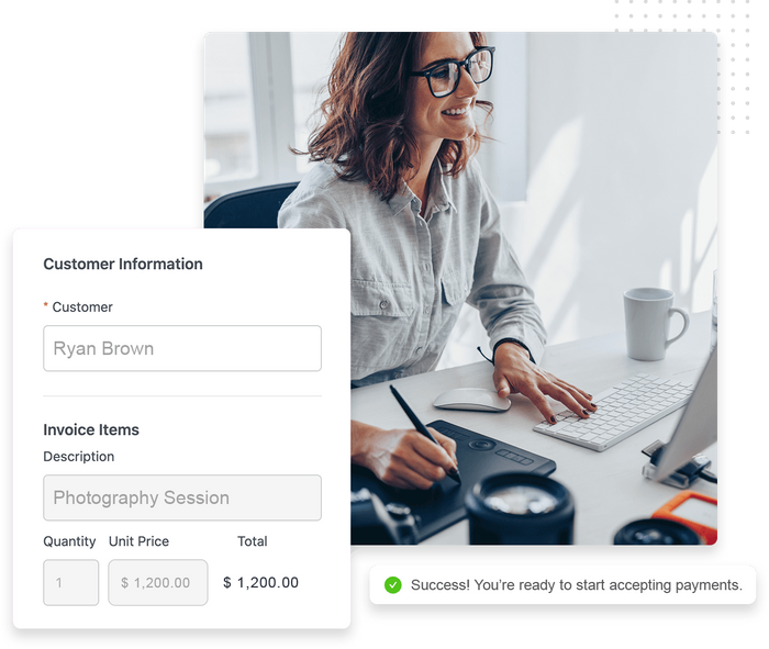 Smiling woman sitting at a computer and drawing on a tablet with a stylus overlaid with new customer payment entry form New customer payment entry form