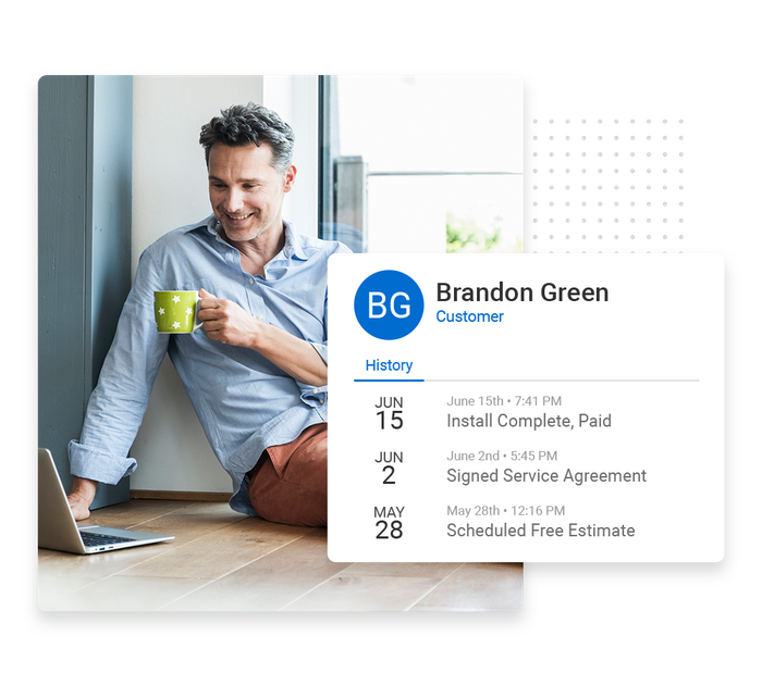 Smiling man sitting on floor with mug and laptop overlaid with client history details from the Marketing 360® CRM Flooring CRM