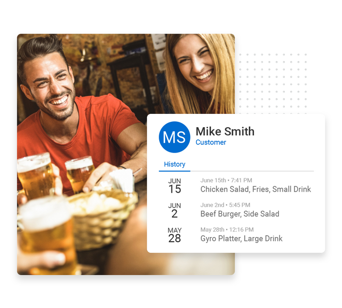 A smiling couple sitting at a restaurant overlaid with client history details from the Marketing 360® CRM restaurant CRM