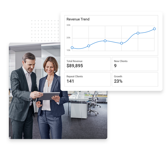 Consultant and client look at tablet in an office overlaid with a revenue trend graph Consultant performance monitoring